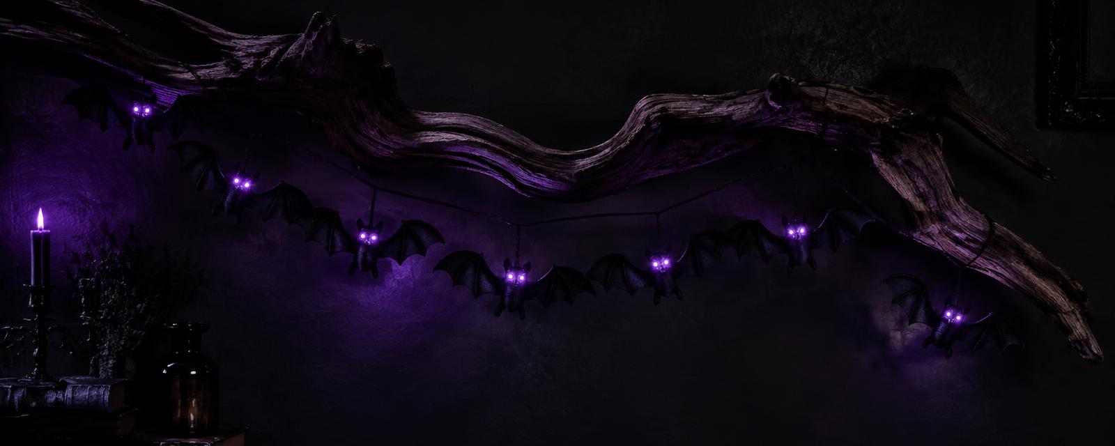 Spooky Deadwood Bat Ornament styled in a Halloween setting